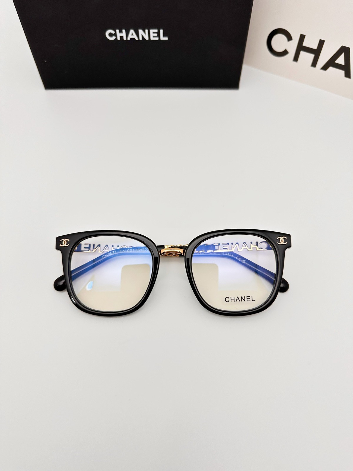One C-brand handbag, one C-brand item, and one pair of C-brand glasses